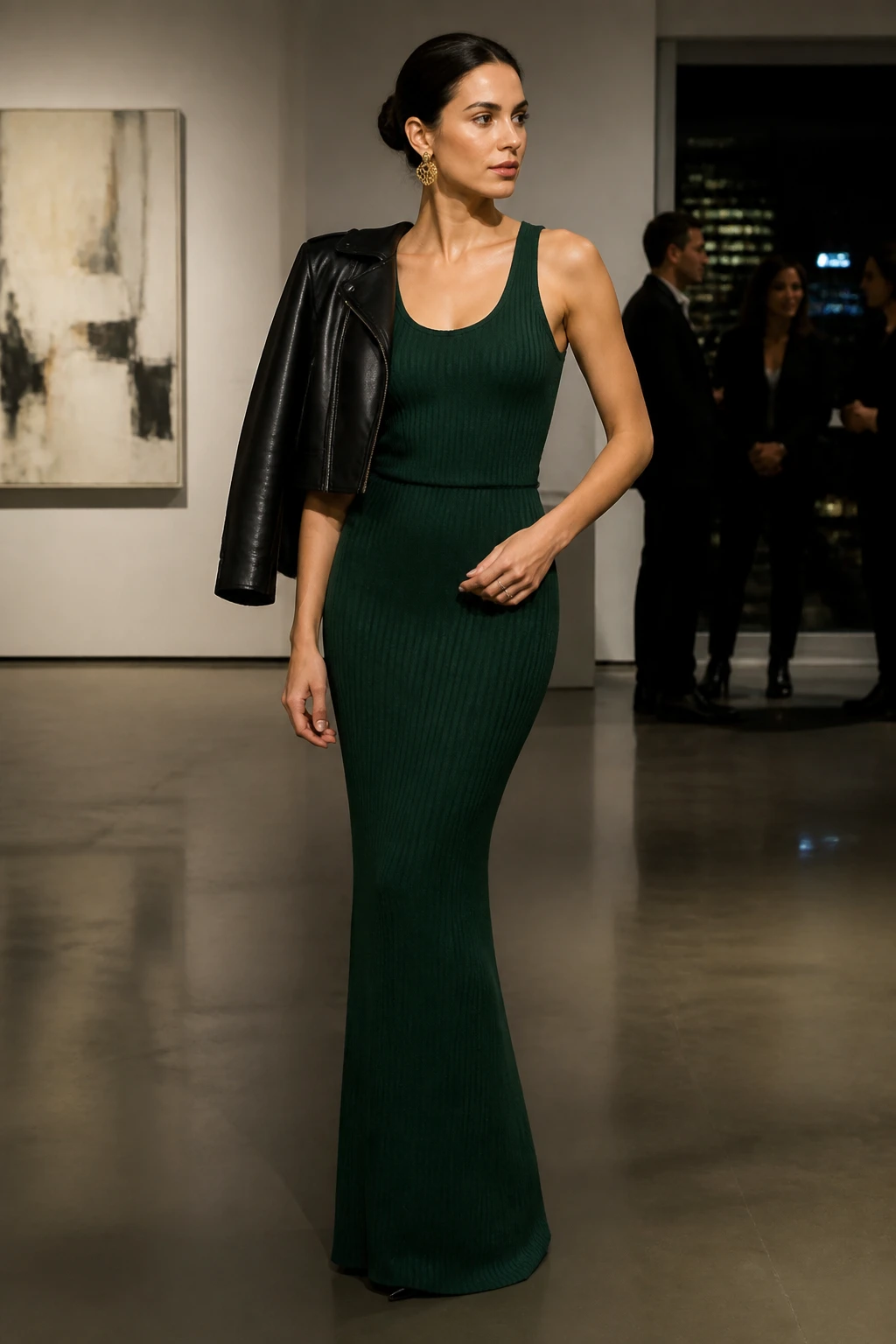 A woman in her early 30s wears a forest green monochrome knit tank and skirt with sock-fit heeled boots and statement earrings at a gallery.